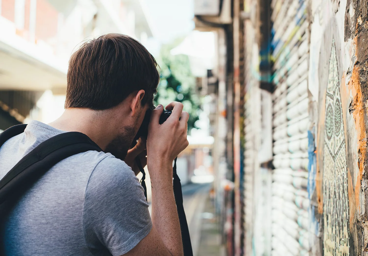 A man with a camera, taking some street pictures