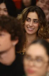 Audience seated during an educational conference in a lecture hall, group listening to a presentation on digital sovereignty.