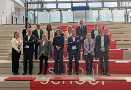 Group photo of BPAURA and emlyon business school teams at campus following partnership renewal announcement