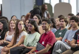 Students attending a welcome session at the emlyon campus, listening to a presentation during orientation and academic year onboarding activities.