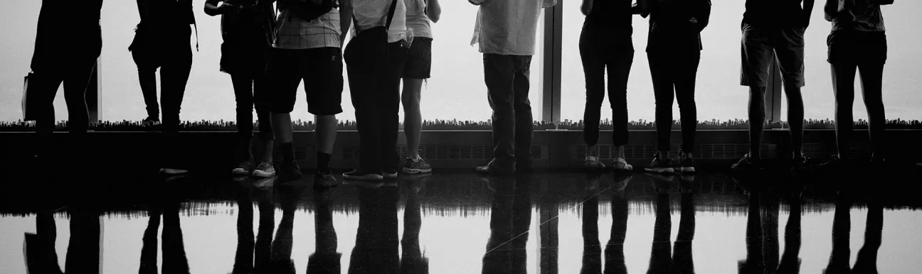 Members and visitors in a collaborative space with a panoramic view.