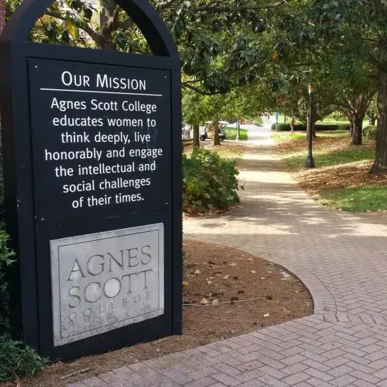 Sign on Agnes Scott Campus with the college's mission statement