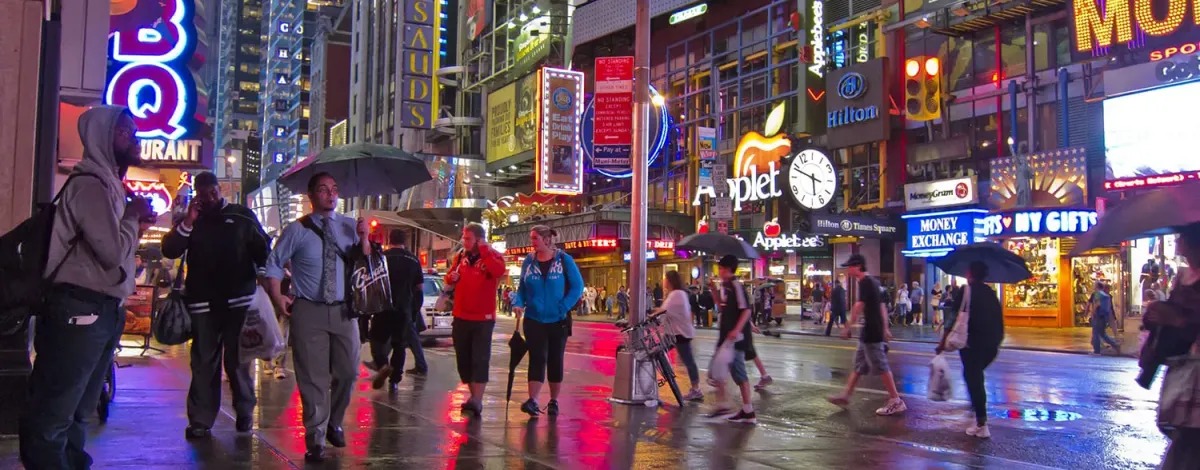 A crowded Time Square at night, NY