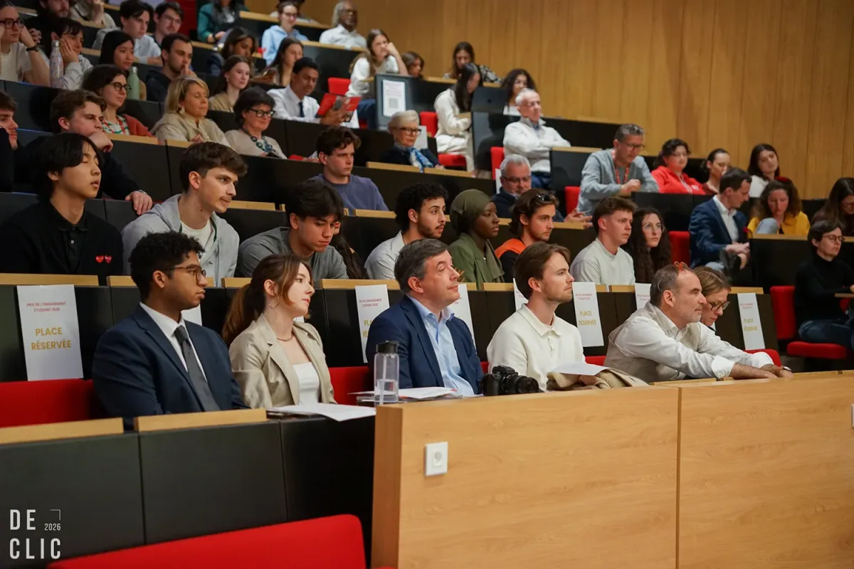Audience seated in the emlyon auditorium during an academic event, with participants attending and DEC’LIC signage visible