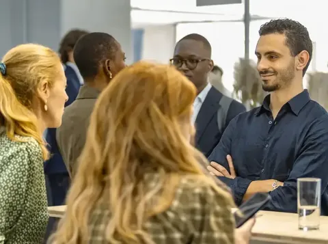 Participants networking at a professional event.